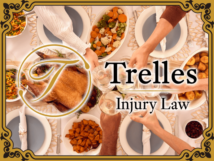 Overhead view of Thanksgiving dinner table with Trelles Injury Law branding