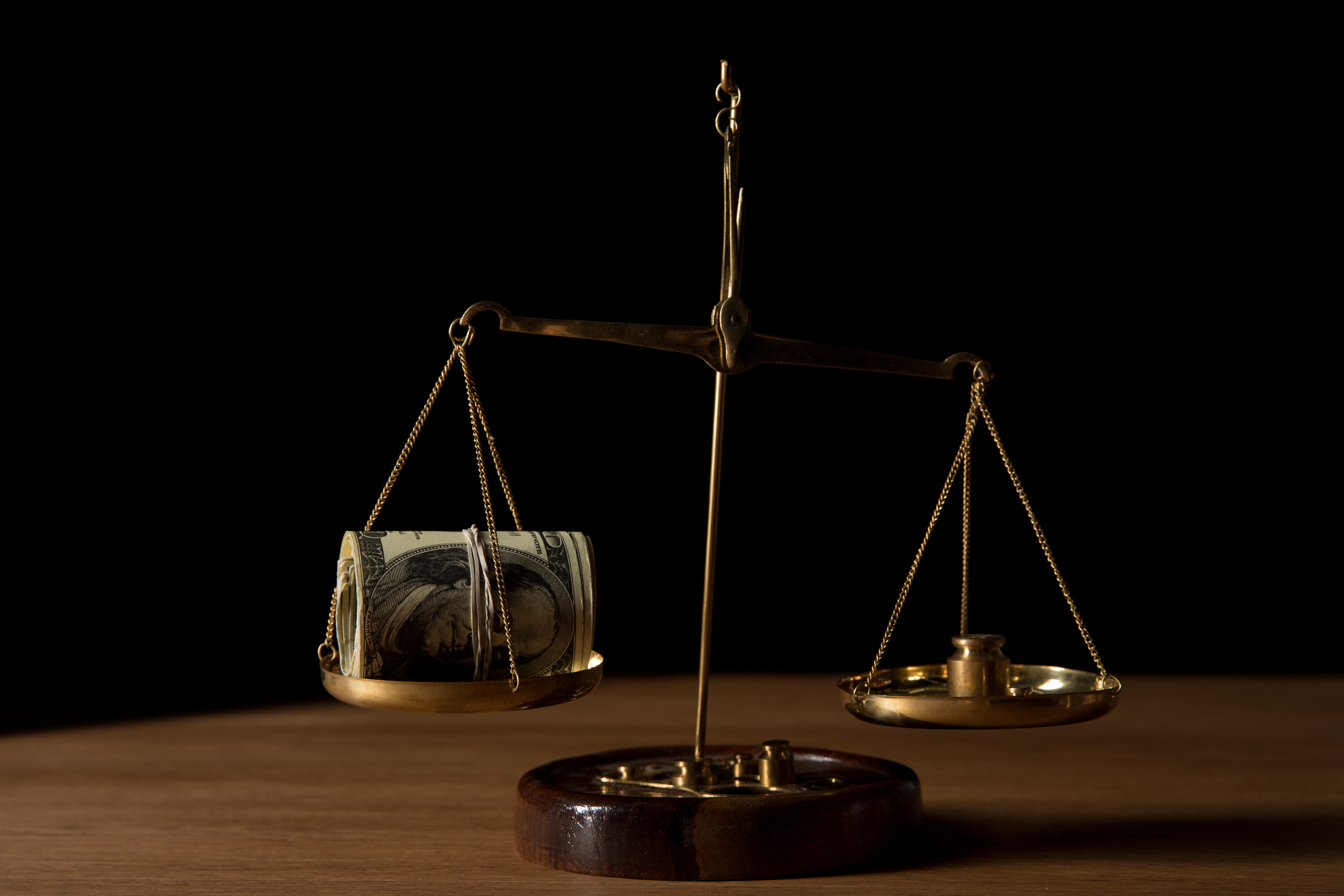 weight scale of money vs a weight