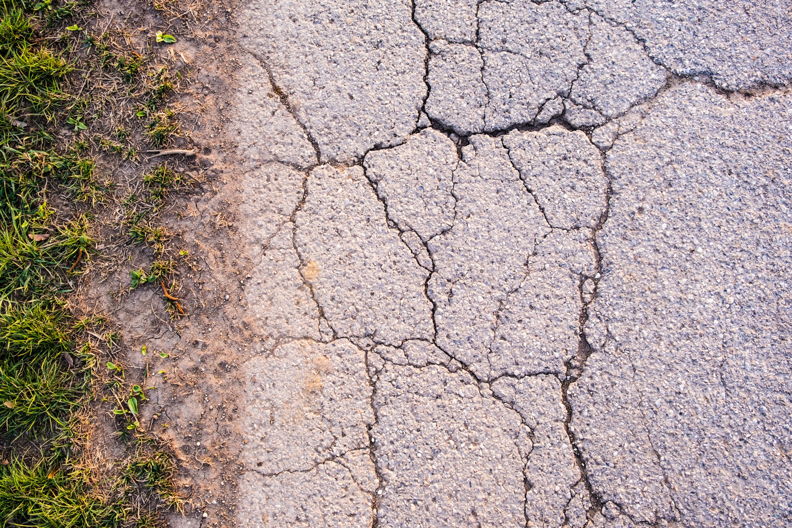 asphalt with cracks all through it
