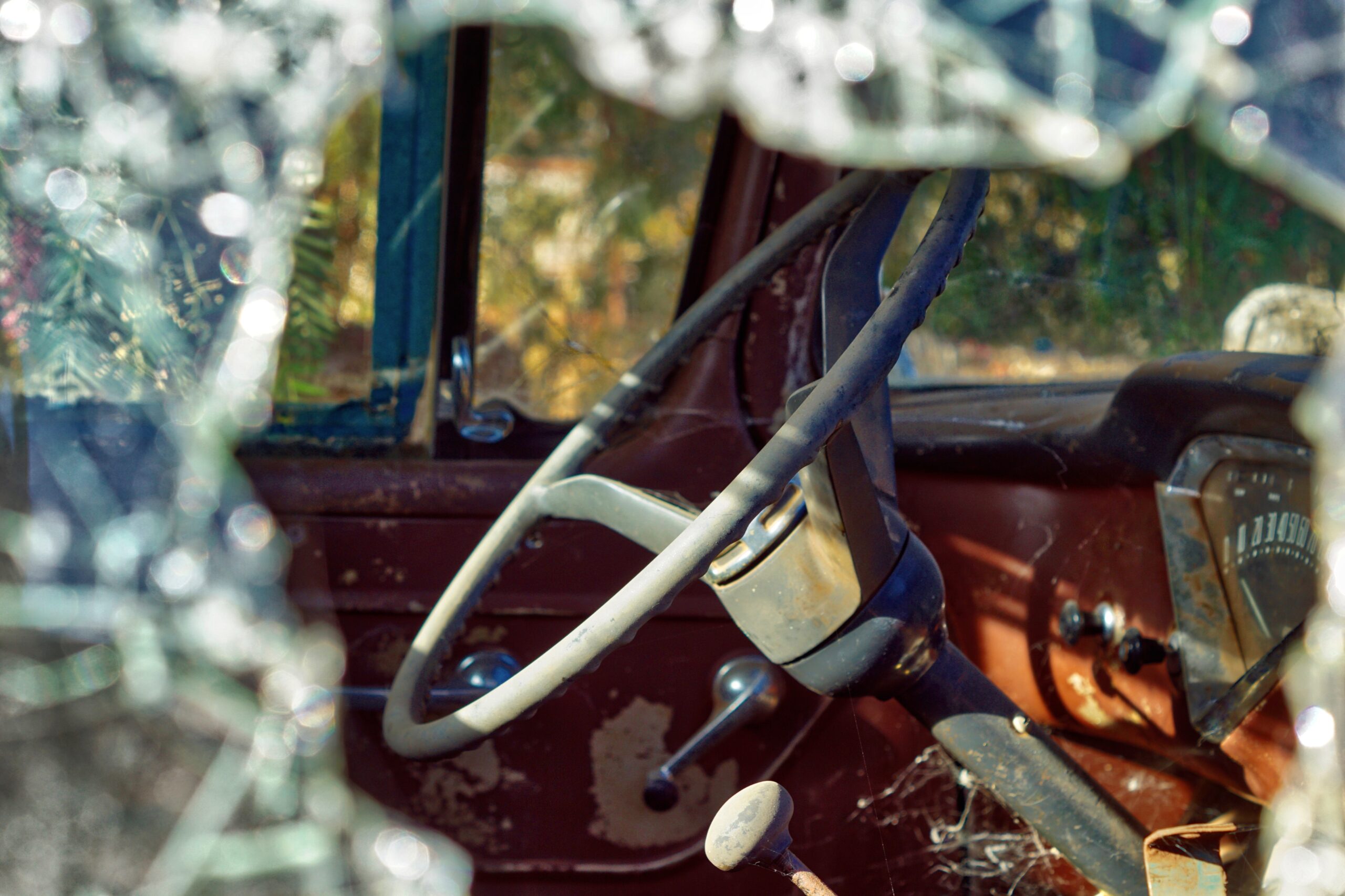 old truck with window smashed in